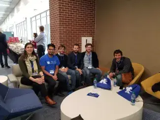 Several people sitting in chairs